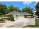 Beautiful home with a large driveway and three-car garage, surrounded by mature trees at 850 Cog Hl, Mcdonough, GA 30253