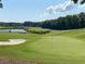 Scenic golf course with lush green fairways, a sand trap and a tranquil lake view, perfect for a round of golf at 850 Cog Hl, Mcdonough, GA 30253