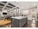 Open kitchen and living area with an oversized kitchen island with seating, and modern decor at 850 Cog Hl, Mcdonough, GA 30253