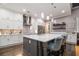 Gourmet kitchen with a large island, white cabinets, quartz countertops, and stainless steel appliances at 850 Cog Hl, Mcdonough, GA 30253