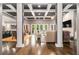 Open-concept living space with hardwood floors, coffered ceilings, and abundant natural light at 850 Cog Hl, Mcdonough, GA 30253