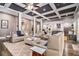 This is an open concept living room with recessed lighting, neutral walls and furniture and a view into the kitchen at 850 Cog Hl, Mcdonough, GA 30253