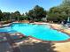 Large outdoor swimming pool featuring multiple stair entrances and lounge chairs for relaxing at 850 Cog Hl, Mcdonough, GA 30253