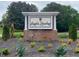 Community entrance sign amidst lush landscaping, welcoming residents and guests to Eagle's Landing Country Club Community at 850 Cog Hl, Mcdonough, GA 30253