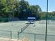 Well-maintained tennis courts with covered seating, perfect for enjoying a match in a beautiful, wooded setting at 850 Cog Hl, Mcdonough, GA 30253