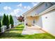 Back patio with pavers, a white picket fence, and a ceiling fan at 2752 Nautical Way, Villa Rica, GA 30180