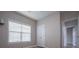 Bedroom featuring natural light, neutral paint, wood-look floors and closet access at 2752 Nautical Way, Villa Rica, GA 30180