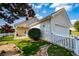 Charming single-story home featuring a well-maintained lawn, white picket fence and attached garage at 2752 Nautical Way, Villa Rica, GA 30180