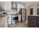 Modern kitchen with stainless steel appliances, and gray island at 2752 Nautical Way, Villa Rica, GA 30180