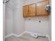 Laundry room with overhead storage, white wire shelving, and vinyl floors at 2752 Nautical Way, Villa Rica, GA 30180