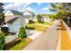 Street view of homes in a neighborhood on a sunny day with a white picket fence at 2752 Nautical Way, Villa Rica, GA 30180
