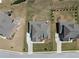 Aerial view showcasing a home with a large driveway, manicured lawn, and mature trees at 4800 Gablestone Xing, Hoschton, GA 30548