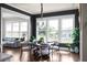 Bright breakfast nook with large windows, a cozy seating area, and views of the backyard at 4800 Gablestone Xing, Hoschton, GA 30548