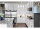 Gourmet kitchen with stainless steel appliances, granite countertops, and custom cabinetry at 4800 Gablestone Xing, Hoschton, GA 30548