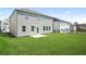 Spacious backyard featuring healthy lawn, neutral siding, and an inviting outdoor space at 7161 Gladstone Cir, Lithonia, GA 30038