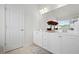 Charming bathroom with double sinks, bright lighting, and elegant white cabinetry at 7161 Gladstone Cir, Lithonia, GA 30038