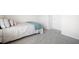 Comfortable bedroom with plush carpet, soft bedding, and ample natural light, creating a relaxing and inviting space at 7161 Gladstone Cir, Lithonia, GA 30038