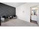 Inviting bedroom with a stylish accent wall and easy access to a well-lit ensuite bathroom at 7161 Gladstone Cir, Lithonia, GA 30038