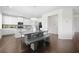Open dining area with designer light fixture and views of the kitchen at 7161 Gladstone Cir, Lithonia, GA 30038
