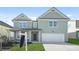Charming two-story home featuring a two-car garage and beautifully maintained front lawn at 7161 Gladstone Cir, Lithonia, GA 30038