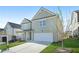 Charming two-story home with a well-manicured lawn, attached garage, and inviting curb appeal in a suburban setting at 7161 Gladstone Cir, Lithonia, GA 30038