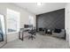 Modern home office featuring a decorative accent wall and ample natural light at 7161 Gladstone Cir, Lithonia, GA 30038