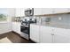 Close-up of kitchen featuring granite countertops and stainless steel appliances at 7161 Gladstone Cir, Lithonia, GA 30038