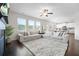 Spacious living room with a large sectional sofa and plenty of natural light at 7161 Gladstone Cir, Lithonia, GA 30038