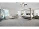 Spacious primary bedroom with natural light and ceiling fan at 7161 Gladstone Cir, Lithonia, GA 30038