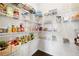 Organized walk-in pantry featuring ample shelving for storage at 7161 Gladstone Cir, Lithonia, GA 30038