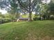 Large backyard with mature trees provides privacy for this lovely brick house at 779 Casplan Sw St, Atlanta, GA 30310