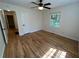 Bright bedroom with hardwood floors, ceiling fan, and natural light through the window at 779 Casplan Sw St, Atlanta, GA 30310