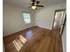 Light-filled bedroom with hardwood floors, ceiling fan and neutral walls at 779 Casplan Sw St, Atlanta, GA 30310