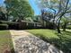 Lovely one-story brick home with attached carport and a sprawling front lawn and mature trees at 779 Casplan Sw St, Atlanta, GA 30310