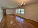 Spacious living room with gleaming hardwood floors and large windows, creating a warm and inviting atmosphere at 779 Casplan Sw St, Atlanta, GA 30310
