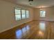 Inviting living room with shiny hardwood floors and bright windows that enhance natural light at 779 Casplan Sw St, Atlanta, GA 30310