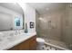 Modern bathroom with a glass shower, elegant vanity, and beautiful tile work at 830 Lee Nw Dr, Marietta, GA 30060