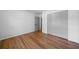 Bedroom featuring hardwood floors, white walls, and a closet at 830 Lee Nw Dr, Marietta, GA 30060