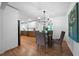 Dining area with hardwood floors, modern light fixture, and view of the kitchen at 830 Lee Nw Dr, Marietta, GA 30060