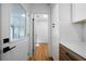 Hallway with hardwood floors leading to an outside screened patio area at 830 Lee Nw Dr, Marietta, GA 30060