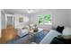 Bright living room with hardwood floors, recessed lighting, and neutral furniture at 830 Lee Nw Dr, Marietta, GA 30060