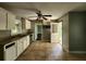 Open kitchen featuring tile flooring, ample counter space, and views into the next room at 1321 Snapfinger Rd, Decatur, GA 30032