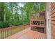 A multilevel back deck with wood railings creates an ideal spot for outdoor living and entertaining at 2650 Wendell Creek Ln, Snellville, GA 30039