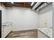 A basement featuring unfinished ceilings, a utility door, modern countertops, and neutral paint at 2650 Wendell Creek Ln, Snellville, GA 30039