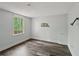 Bedroom featuring wood-look floors and a window offering natural light at 2650 Wendell Creek Ln, Snellville, GA 30039