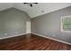 This bedroom has a vaulted ceiling, wood flooring, and a window providing natural light at 2650 Wendell Creek Ln, Snellville, GA 30039