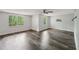 Spacious bedroom with updated wood-look flooring and windows overlooking the outdoor scenery at 2650 Wendell Creek Ln, Snellville, GA 30039