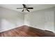 Bedroom featuring hardwood floors, a ceiling fan, and a closet at 2650 Wendell Creek Ln, Snellville, GA 30039