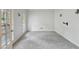 Bedroom with carpet, natural light from windows, and access to outdoor space at 2650 Wendell Creek Ln, Snellville, GA 30039