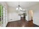 Dining area showcasing hardwood floors, natural light, and stainless steel appliances at 2650 Wendell Creek Ln, Snellville, GA 30039